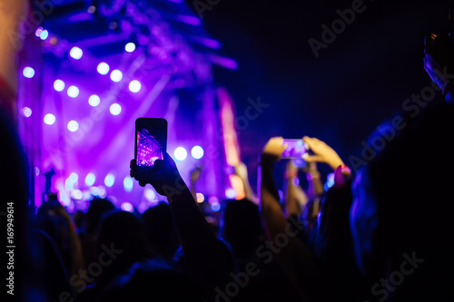 People Taking Photos At A Music Concert
