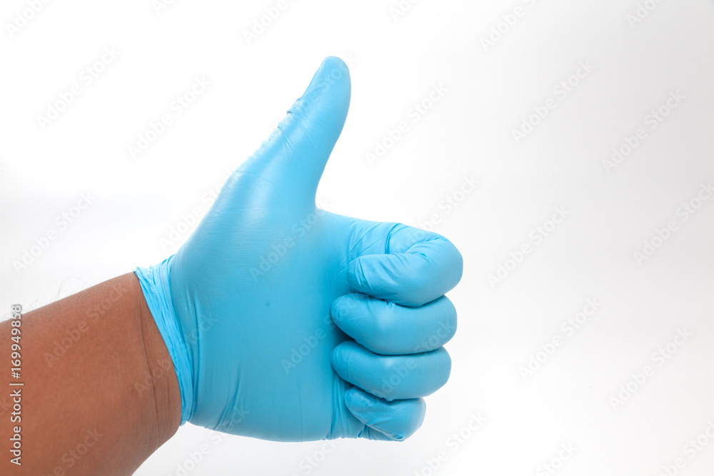 hand in blue glove Giving Thumbs Up Sign hand in blue glove Giving Thumbs Up Sign