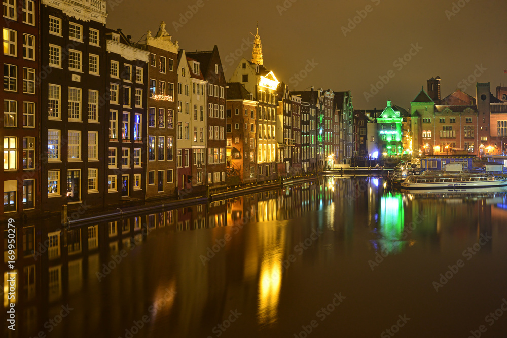 Amsterdam in the bright lights of the night city