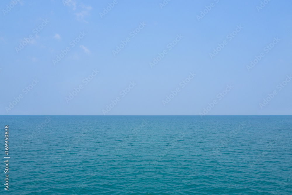 tropical sea and beach with blue sky background