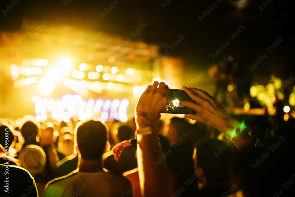 People Taking Photos At A Music Concert