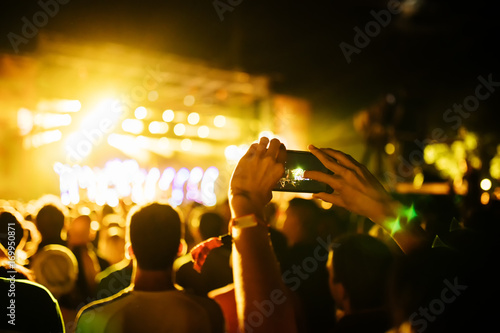 People Taking Photos At A Music Concert