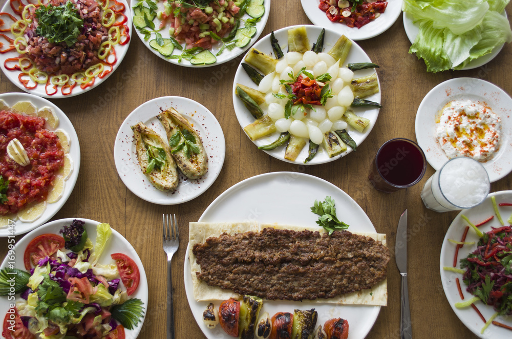 Kebab; healthy and fresh salad varieties and appetizer on wooden table Kebab; healthy and fresh salad varieties and appetizer on wooden table