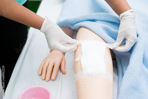 Nursing student were trained how to wound care patient. She practice training with the Doll of patient, Before treatment to the real patient.