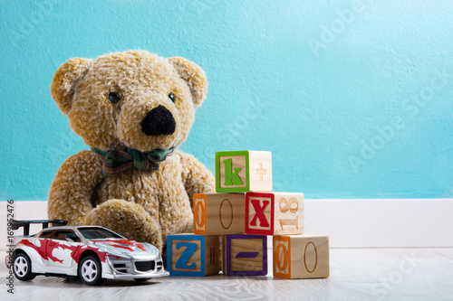 Teddy bear and toys in a baby's room

 photo