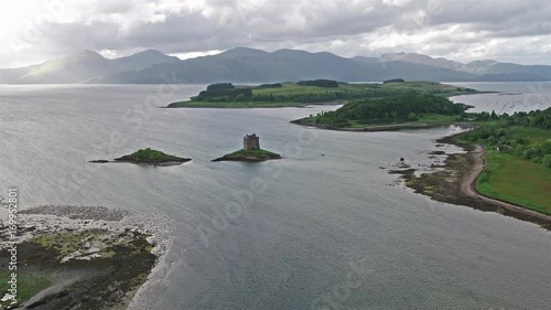 Aerial of Loch Laich and the historic castle Stalker in background photo