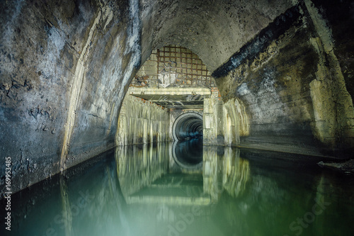 Flooded by wastewater sewage collector. Sewer tunnel under city