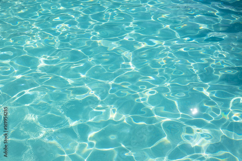 Close up of shiny blue water of swimming pool