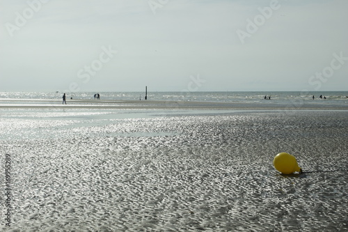 Buoy on the beach of Nieuwpoort and Oostduinkerke Belgium