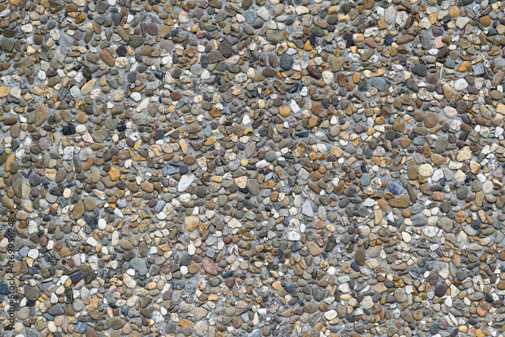 Background photo of colored gravel in a concrete precast slab. Background photo of colored gravel in a concrete precast slab.