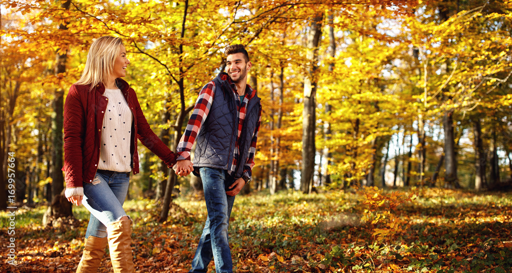 Fototapeta premium smiling couple having fun in park.