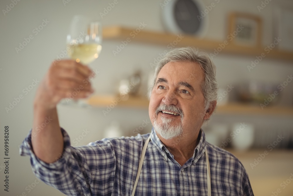 Senior man holding a glass of wine Senior man holding a glass of wine