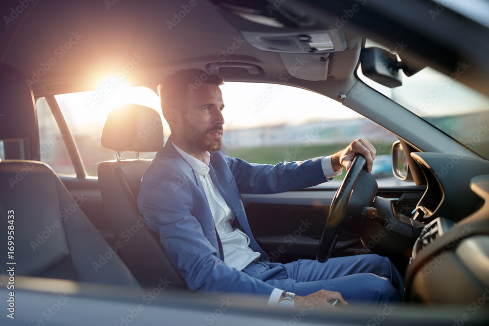 Fototapeta premium Businessman manager traveling in car.