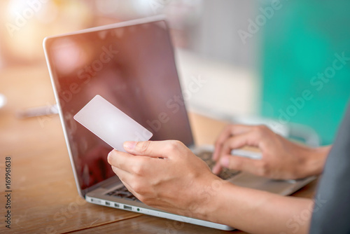 Businesswoman holding credit card, shopping online