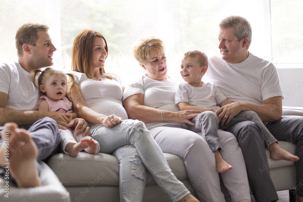family, happiness, generation and people concept on the sofa family, happiness, generation and people concept on the sofa