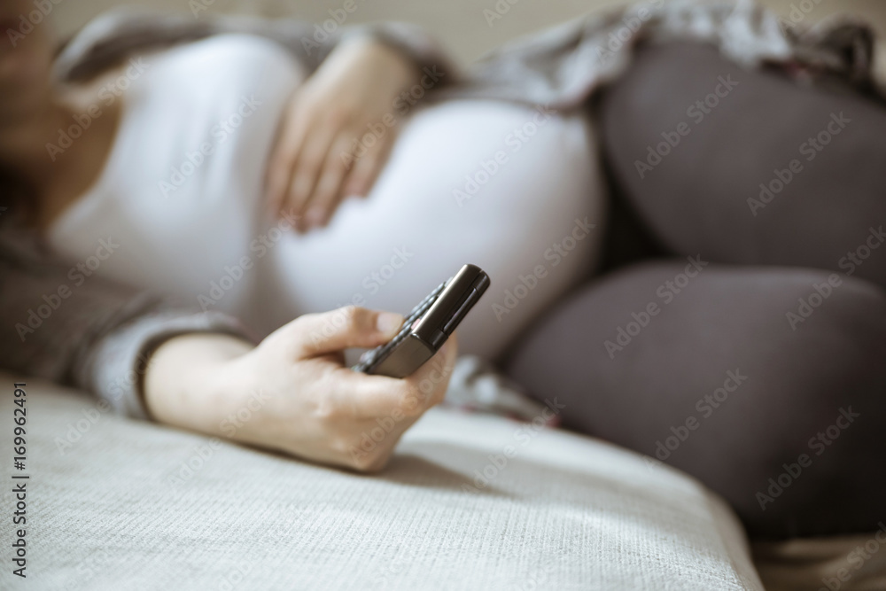 Pregnant Woman Changing Channels Pregnant Woman Changing Channels