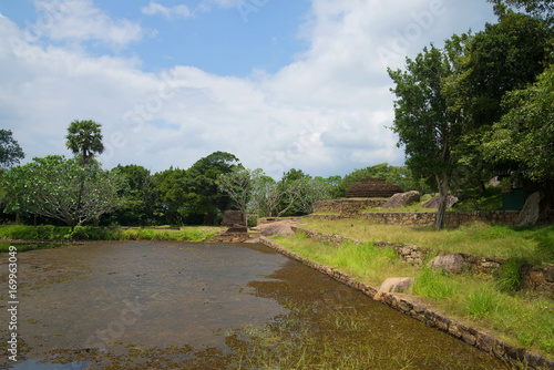 Ruins of the ancient Buddhist temple of the monastery Rajagiri Kanda at the Black Water Pond (Kaludiya Pokuna). Mihintale, Sri Lanka