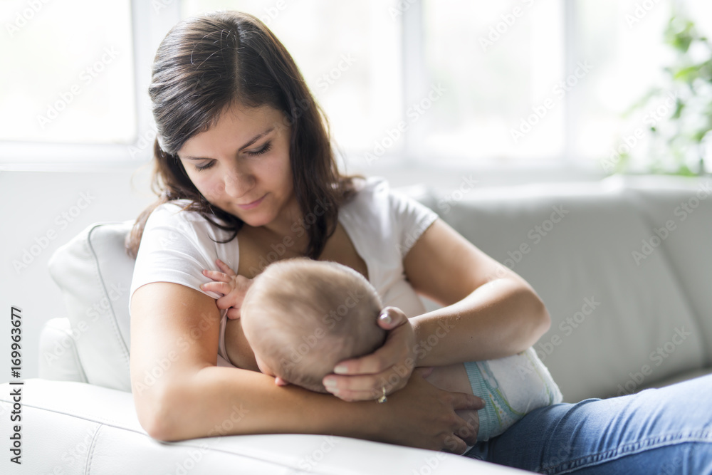 mother Breast feeding his baby at home mother Breast feeding his baby at home