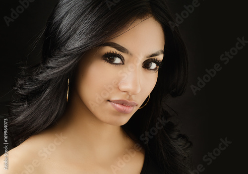 Beautiful face of young woman with dark hair