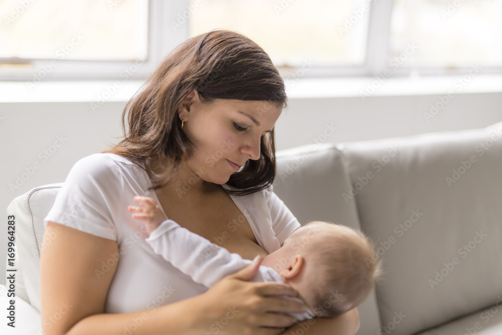 mother Breast feeding his baby at home mother Breast feeding his baby at home