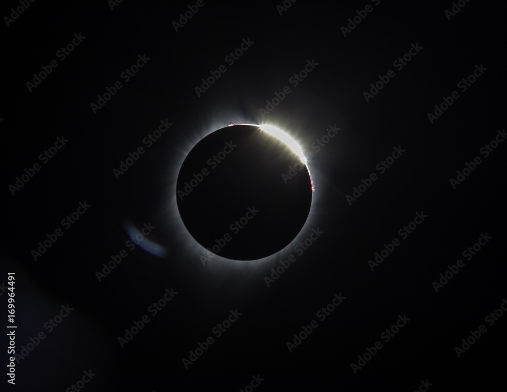 Diamond ring and red Prominence glowing in space