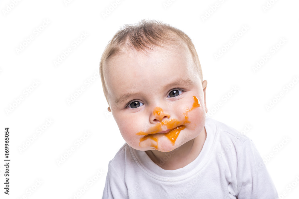 Adorable baby girl making a mess while feeding Adorable baby girl making a mess while feeding