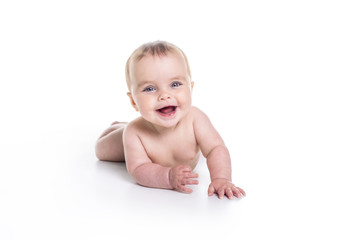 Sweet little girl on the floor of studio white background