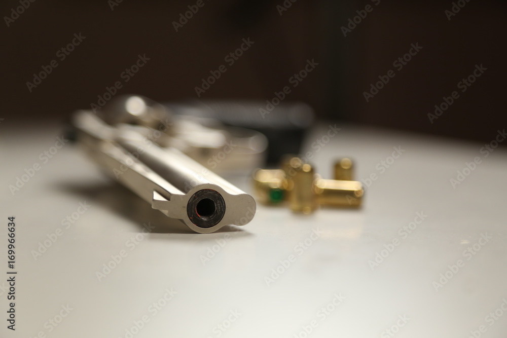 Bullets and Gun Closeup Shot Bullets and Gun Closeup Shot