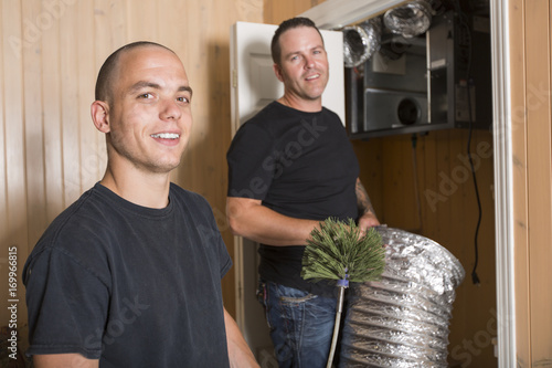 ventilation cleaner man at work with tool photo