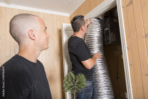 ventilation cleaner man at work with tool photo