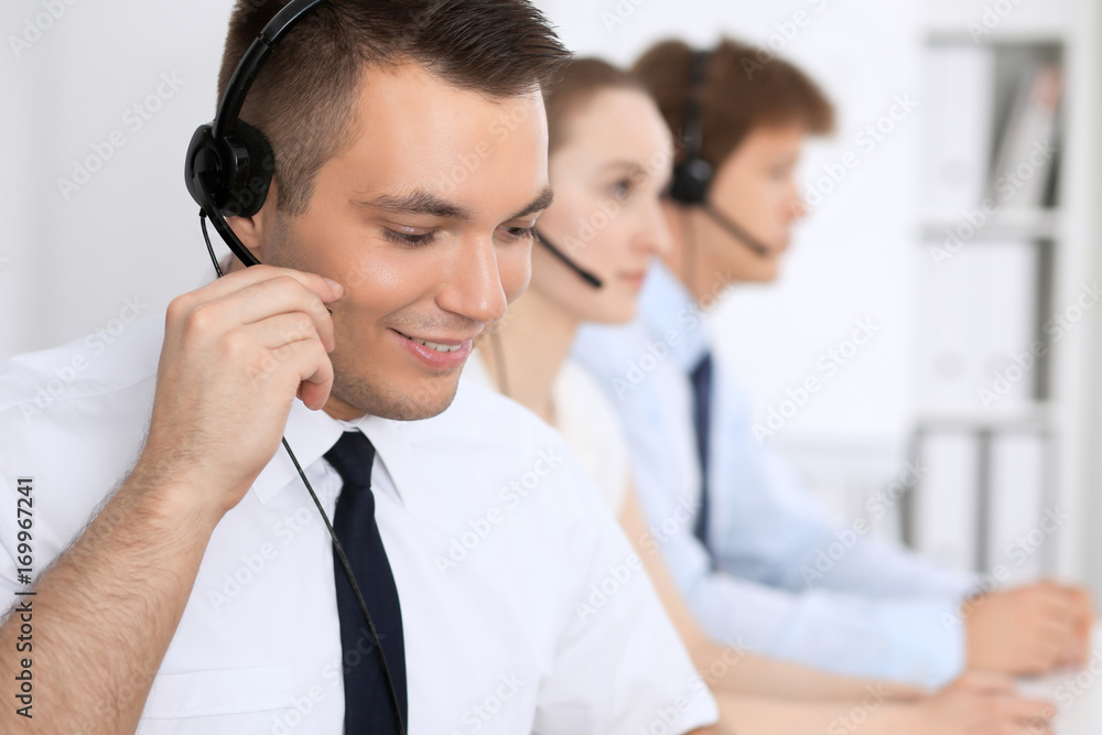 Young business man in headset. Call center Young business man in headset. Call center