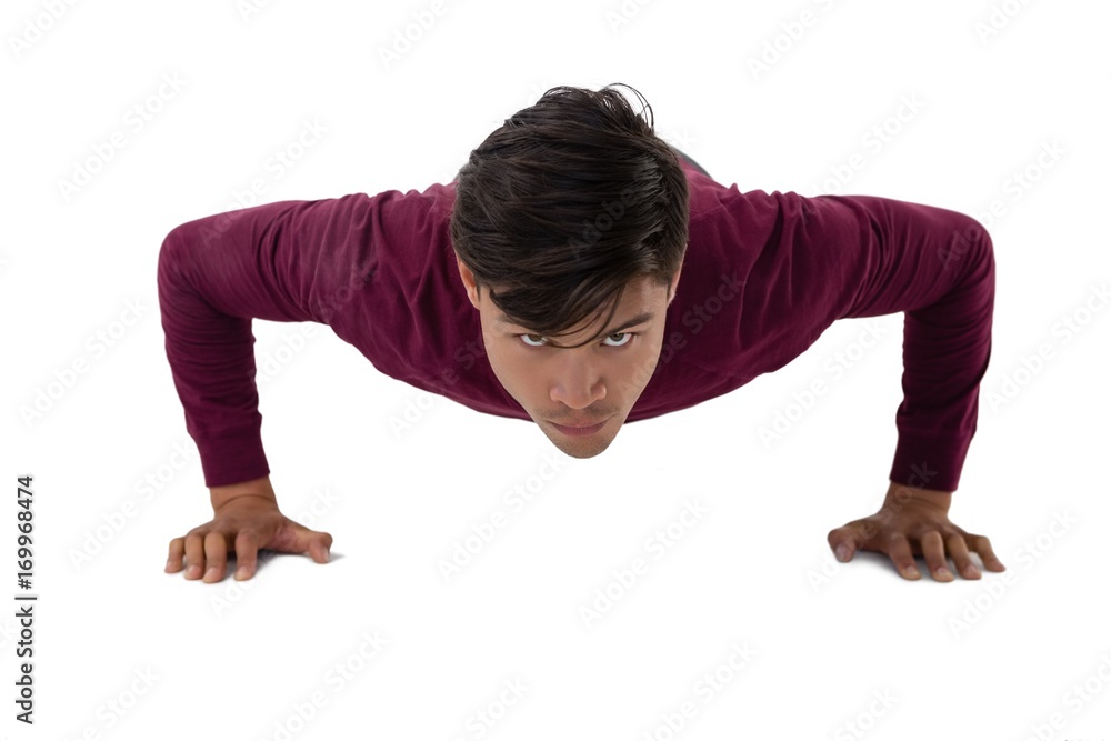 Portrait of young creative businessman doing push ups Portrait of young creative businessman doing push ups