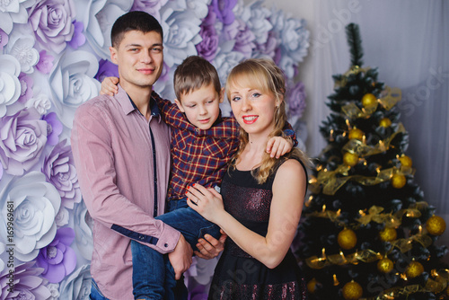 Beautiful family in Christmas interior
