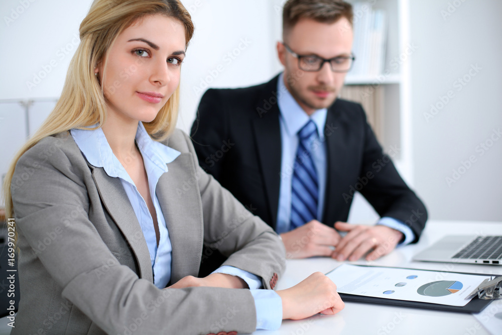Successful business people working at meeting in office background Successful business people working at meeting in office background