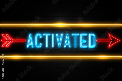 Activated - fluorescent Neon Sign on brickwall Front view