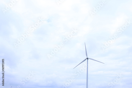 Modern Wind Mill with Heavy Clouds in the Distance