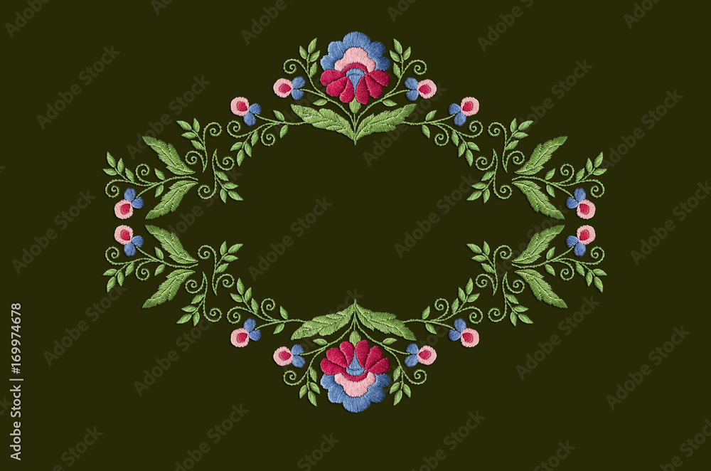 Frame pattern with a stylized flower with large leaves and twisted stems on dark green background