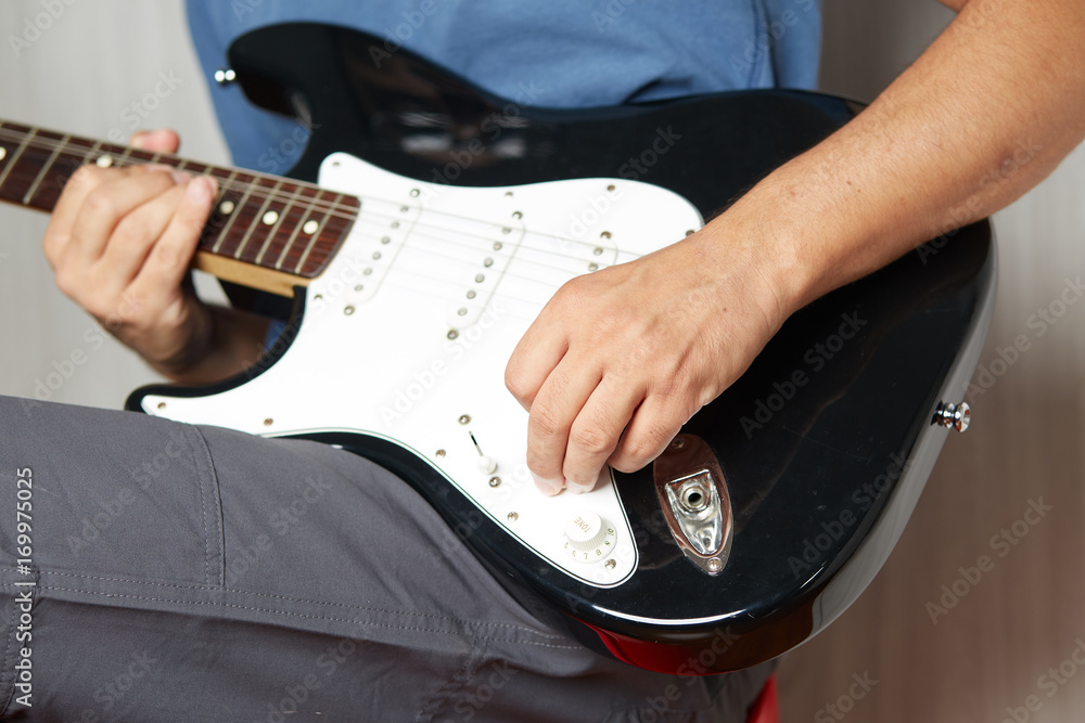 Obraz premium Close up of a lefty electric guitar being played