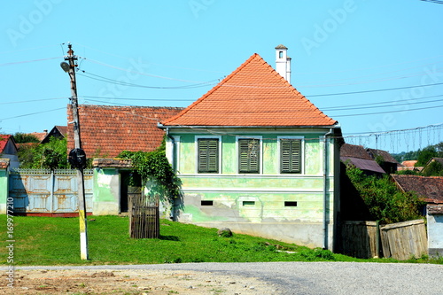 Typical rural landscape and peasant houses in  the village Somartin, Martinsberg, Märtelsberg, Transylvania, Romania. The settlement was founded by the Saxon colonists. photo