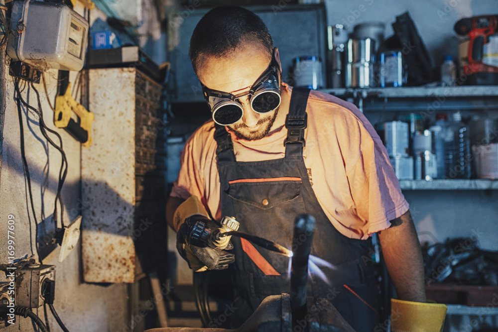 Welder Working in His Workshop Welder Working in His Workshop