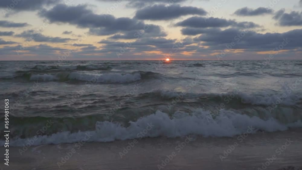 Beautiful sunset at the beach, amazing colors, light beam shining through cloudscape over seascape. Marine sunset. Sunrise at beach. Sunset on beach. Sunset At Sea. Sunrise At Sea. Slow Motion Beautiful sunset at the beach, amazing colors, light beam shining through cloudscape over seascape. Marine sunset. Sunrise at beach. Sunset on beach. Sunset At Sea. Sunrise At Sea. Slow Motion