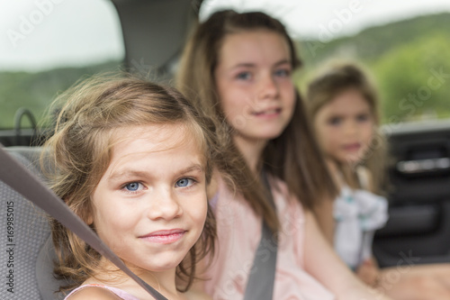 little girls inside car