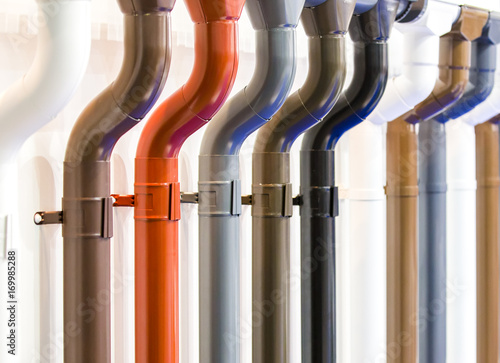 Closeup of rain gutter and downspout. Different color options. Drain pipes