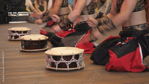 Musicians play the taiko shime-daiko drums on scene During the japanese festival.