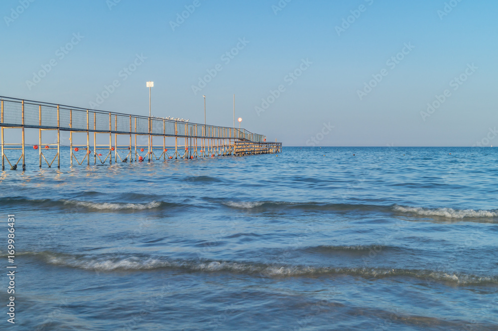 Fototapeta premium beach and sea at blue hour, summer vacation at the sea