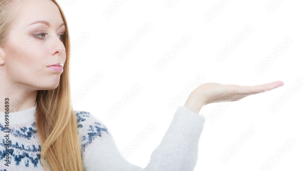 Teenage blonde woman pointing at copyspace Teenage blonde woman pointing at copyspace