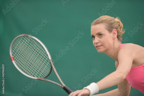 female tennis player preparing to hit © auremar