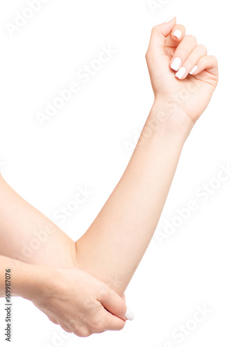 Female hand hurts the elbow of a hand