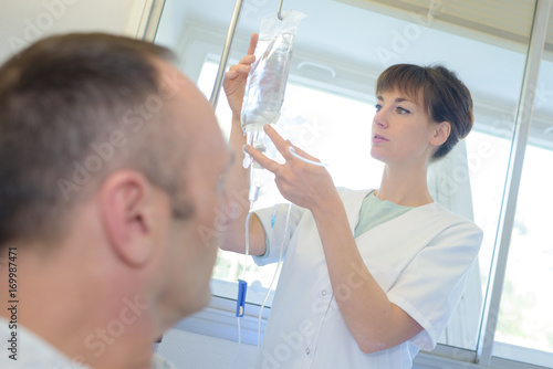 nurse checking her patients perfusion photo