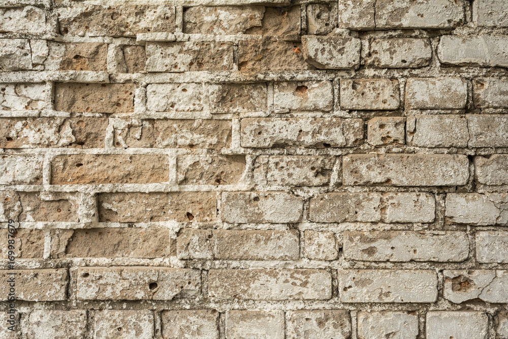 texture of an old ruined brick wall of an ancient building